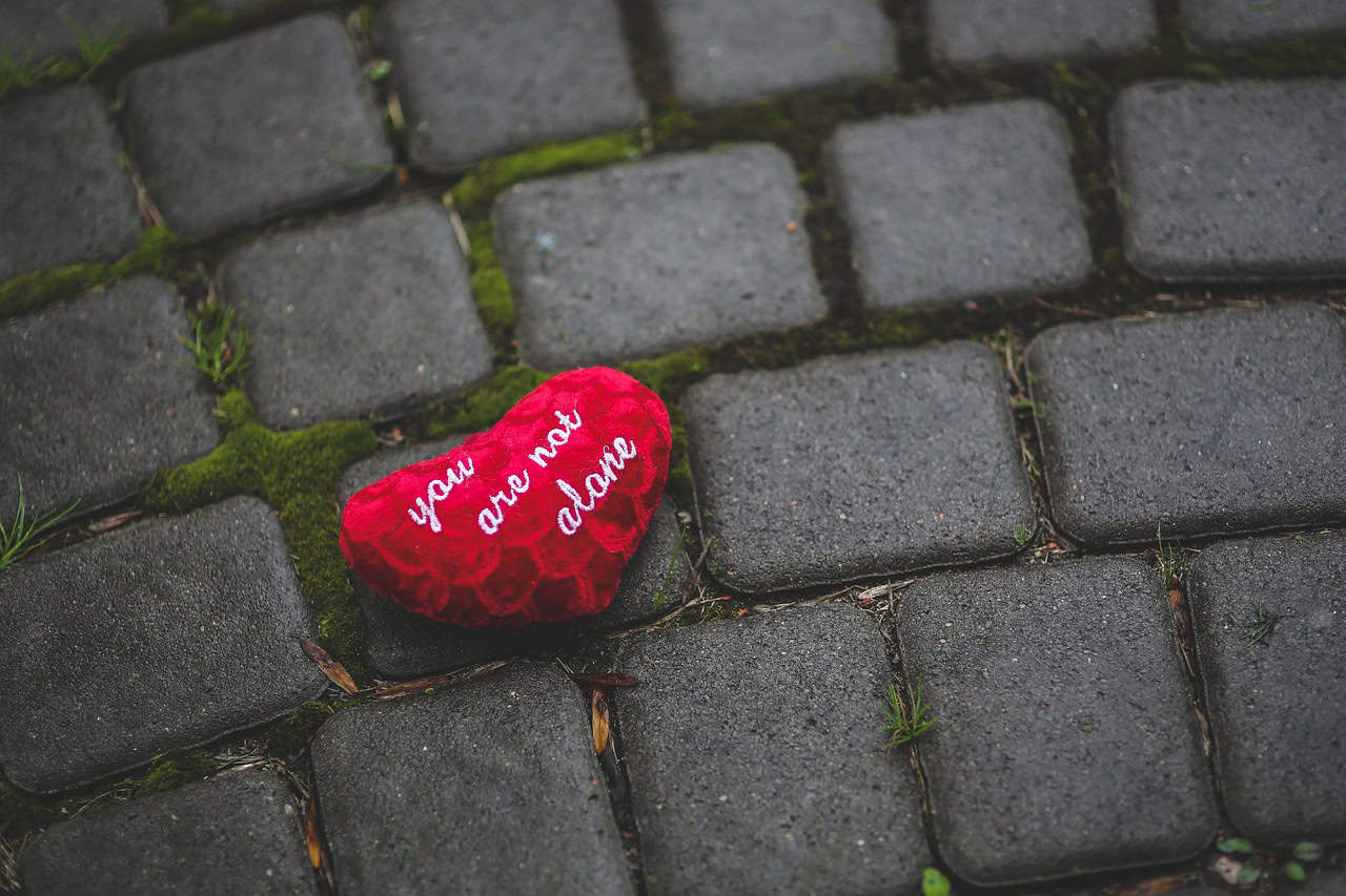 heart on a cobblestone walkway