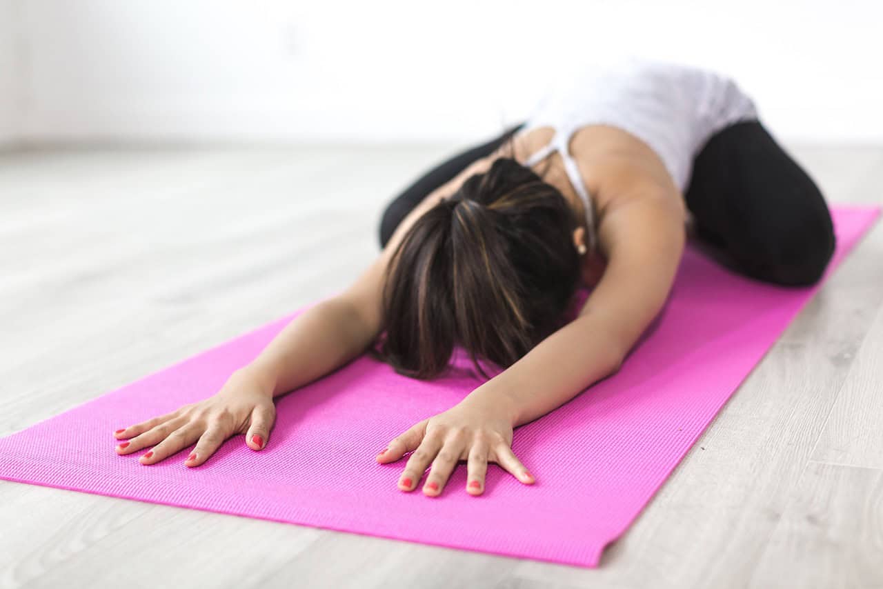 woman in child pose yoga